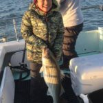 Alex Miyoshita of Orange County with 16-pound striped bass on Nautilus Excursions in San Pablo Bay