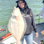 Ocsanna Seropyan, manager of the Fishermen’s Warehouse in Manteca, with a quality halibut on the Pacific Dream