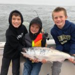 Kent Hall, Cole Anderson, and Wyatt Keefe with Duxbury salmon with dads Kent Hall and Justin Anderson