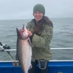 Lauren Carter of Santa Clara with her first fish ever – a 20.72-pound salmon on the New Captain Pete with Captain Dennis Baxter