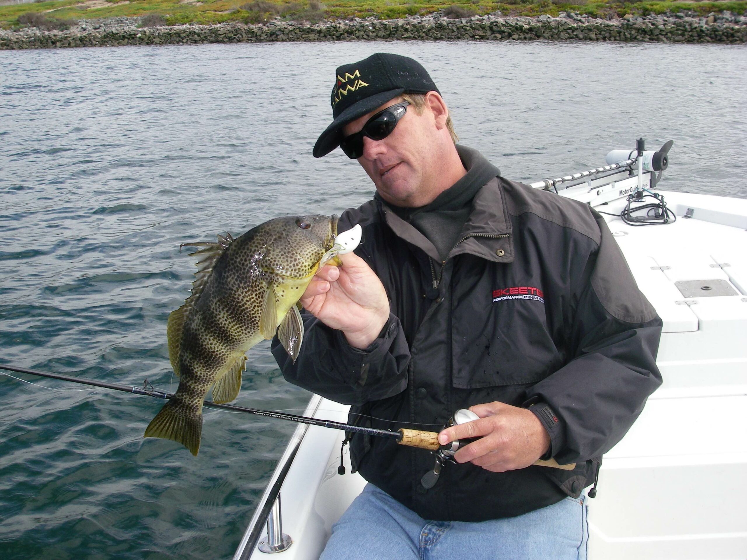 Guy Catching Bass in Kayak Screaming