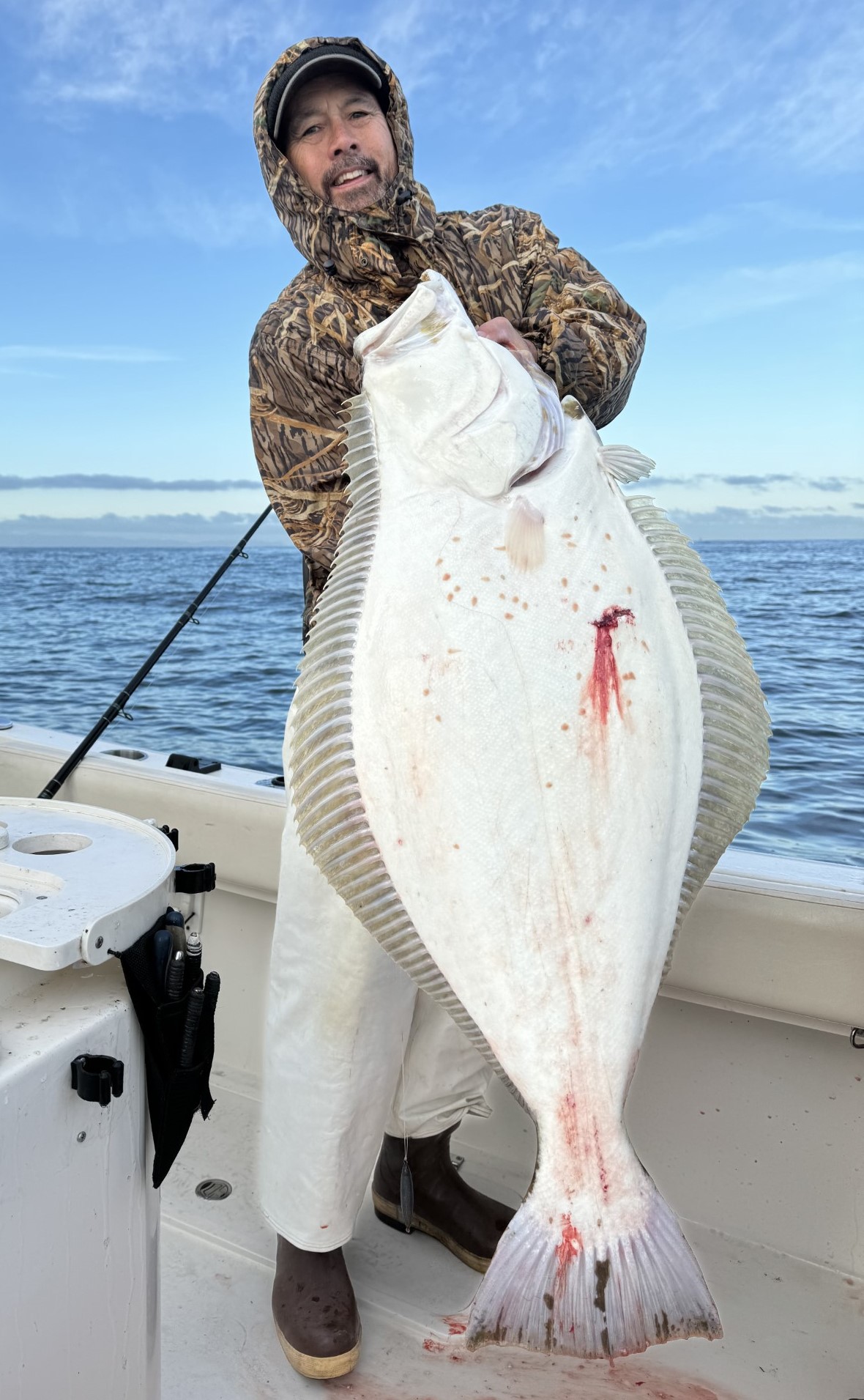 LOCAL WATERS FLATFISH – This 30 pounder was caught by Merit McCrea just outside the Federal Breakwater off Long Beach. A live sardine proved a fatal attractant for this fish. PHOTO BY “IZORLINE” WENDY TOCHIHARA